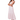 A woman wearing a cerise pink floral maxi dress with smocked bodice and cap sleeves.