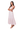 A woman wearing a cerise pink floral maxi dress with smocked bodice and cap sleeves.