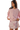 A woman wearing a pink longsleeve pullover sweatshirt with a logo embroidery