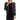 A woman wearing a black puffer jacket with cream accents and pearl detailing, paired with a black dress. The jacket features a front zipper and a fur lining on the hood.