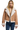 A woman wearing a cognac brown vegan suede shearling leather jacket with faux fur details around the neck and cuffs, paired with blue jeans.