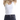 woman wearing a white ribbed tank top with black jeans